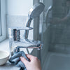 How to remove limescale from taps and shower heads